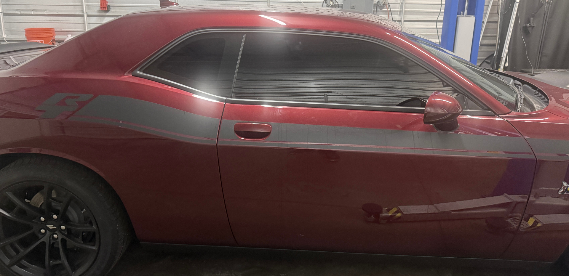 Red Dodge Challenger with freshly tinted windows at Next Level Detail in Kingston, PA